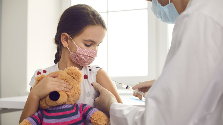 child getting vaccine