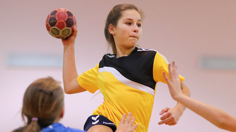 Girl playing handball in competition