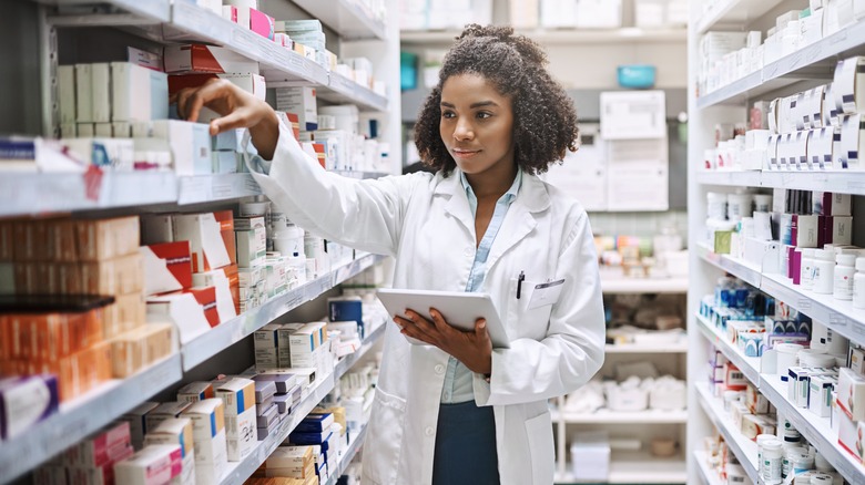 Pharmacist looking at inventory