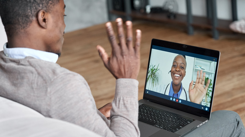 man and doctor in virtual appointment