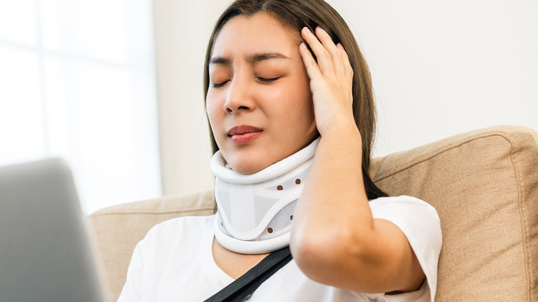 Injured woman wearing neck brace