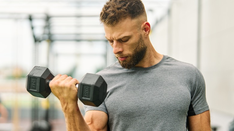 Man doing dumbbell curls