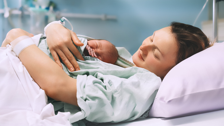 mom hold her baby in hospital