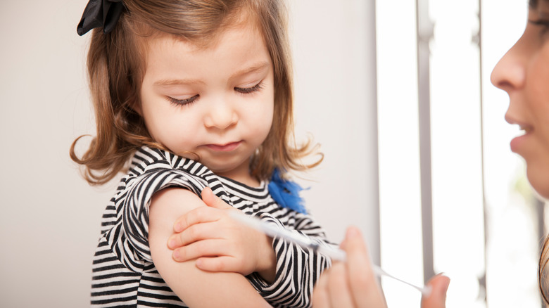 toddler getting a shot 