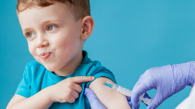 young boy getting a vaccine 