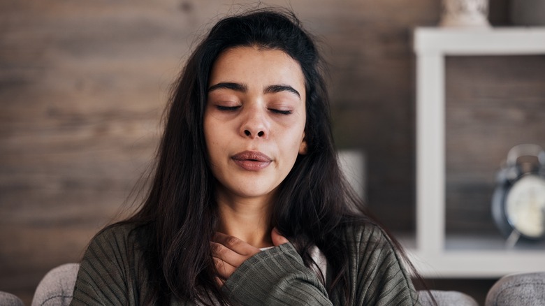 Woman doing breathing exercises