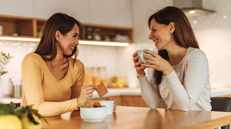 women enjoying cookies and tea