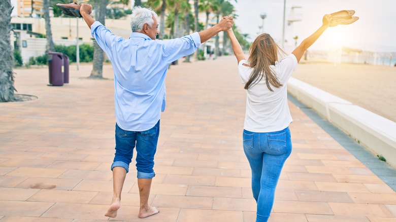 Couple walking backward