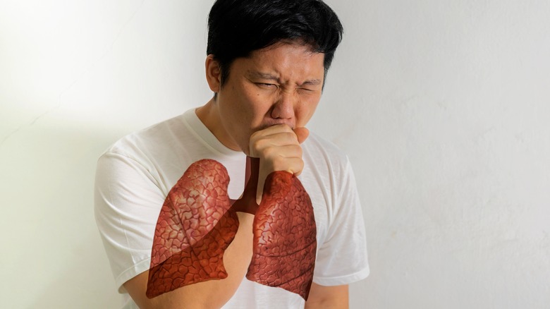 man coughing graphic overlay of lungs