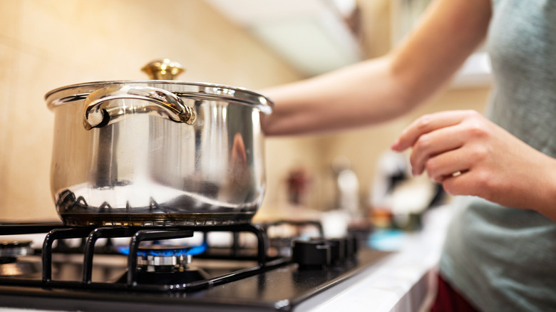 Pot boiling on gas stovetop
