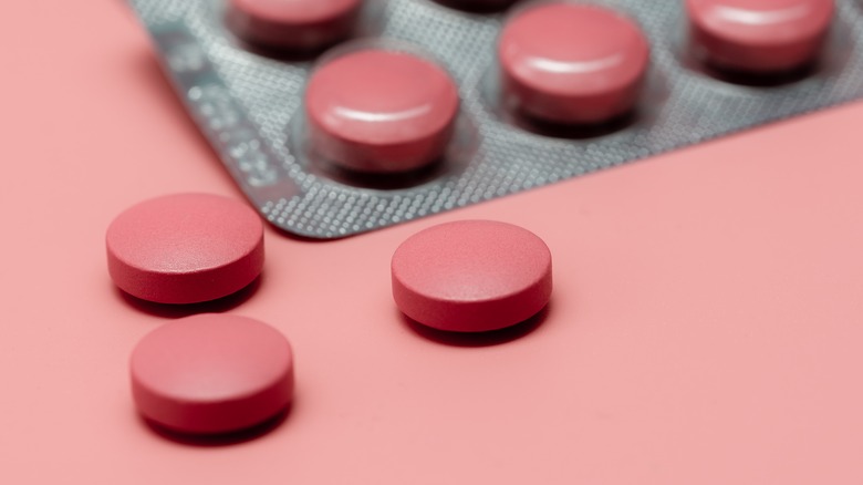 tablets on pink table