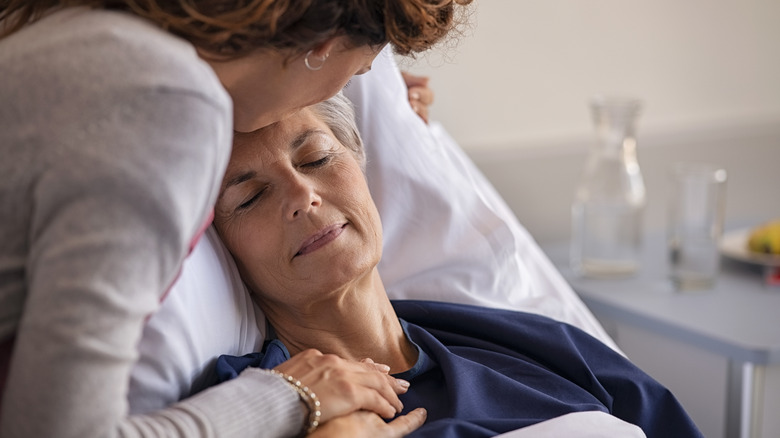 Sick mother and caring daughter