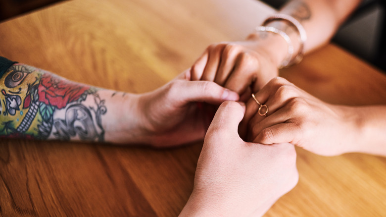 Couple holding hands