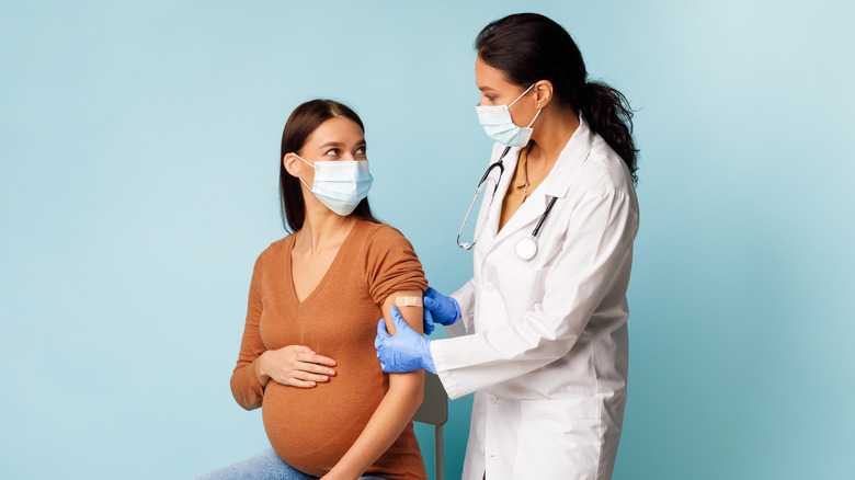 A pregnant woman gets vaccinated