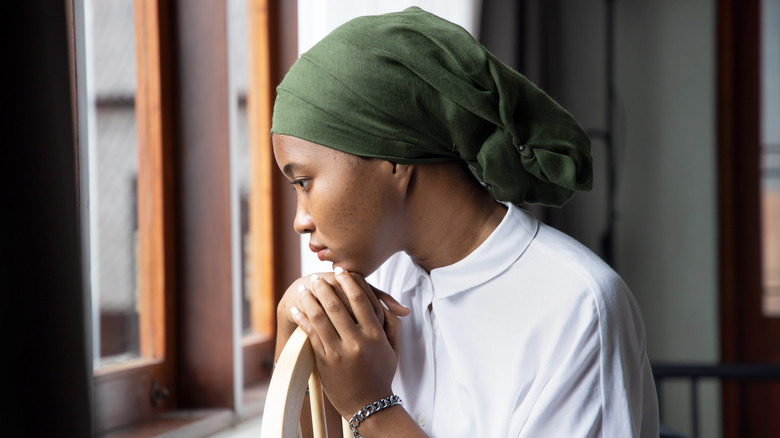 sad Black woman battling cancer