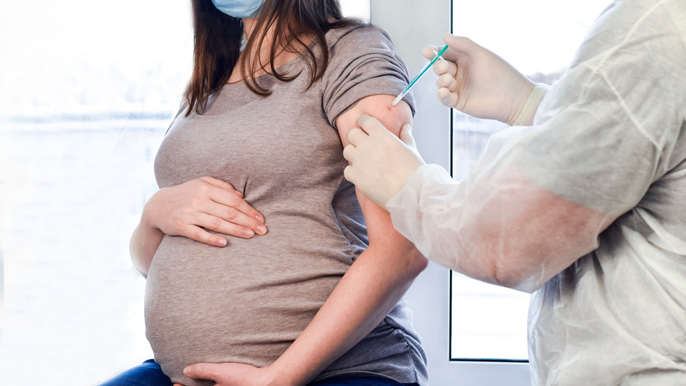 Pregnant woman getting vaccine