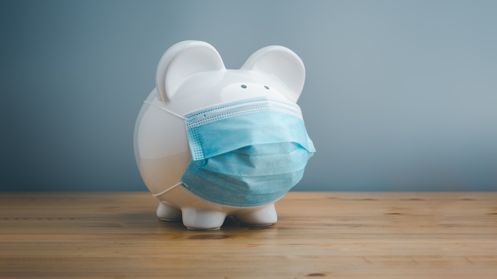 Piggy bank wearing surgical face mask