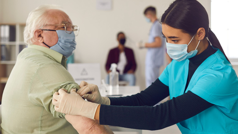 Older man receiving vaccine