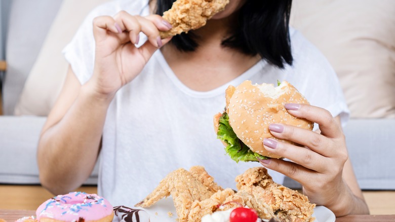 Woman eating fried chicken