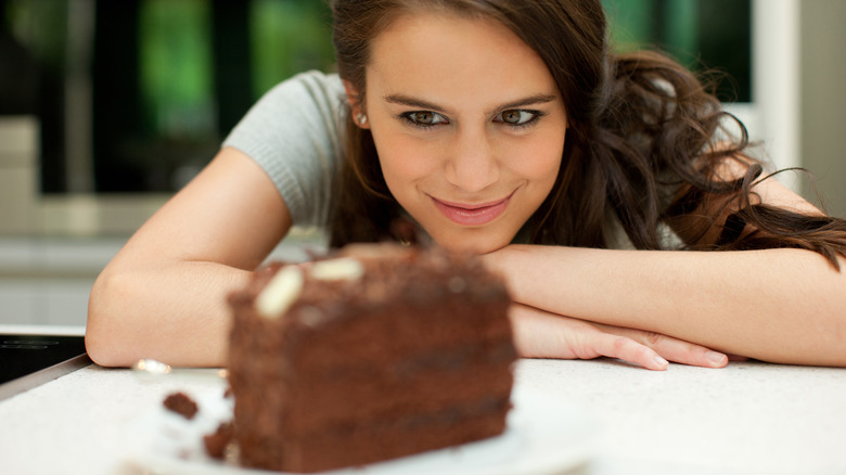 Woman looking at piece of cake