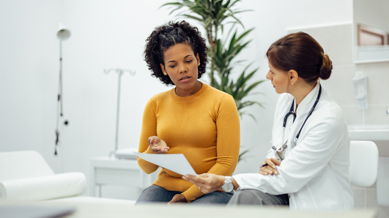 Doctor discussing results with female patient
