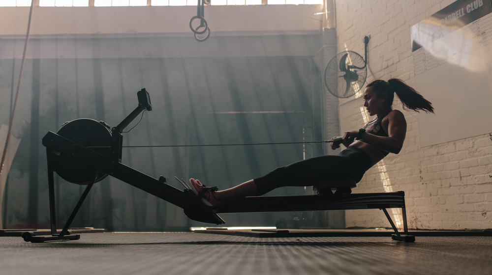 woman using rower