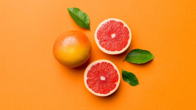 Grapefruit on orange background