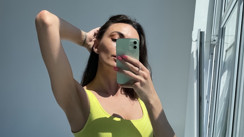 thin woman posing for selfie