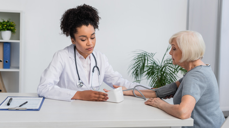 doctor taking blood pressure