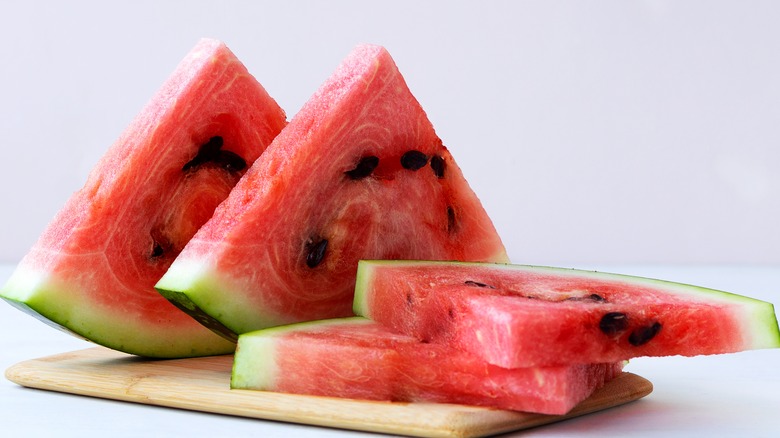 Watermelon slices on cutting board