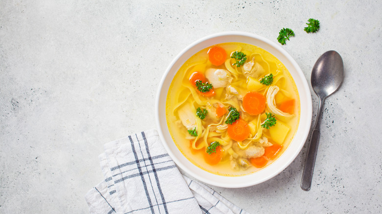 Bowl of chicken soup with carrots