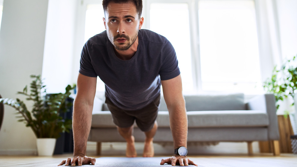 man doing pushup plank