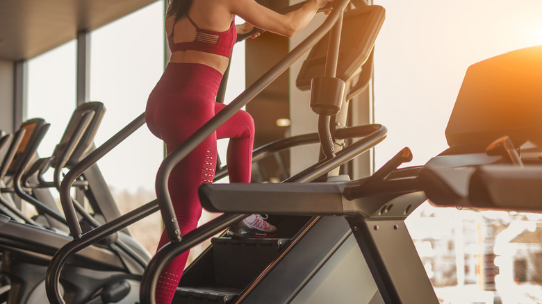 woman using Stairmaster at gym