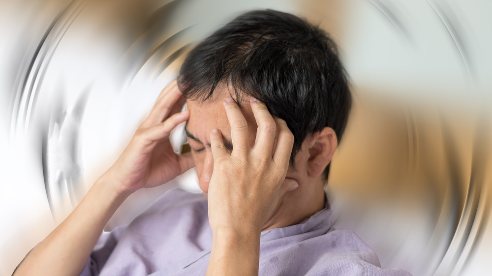 Headache, brain injuries from suppressing a sneeze