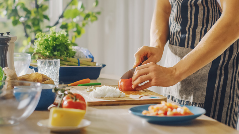 Person chopping vegetables