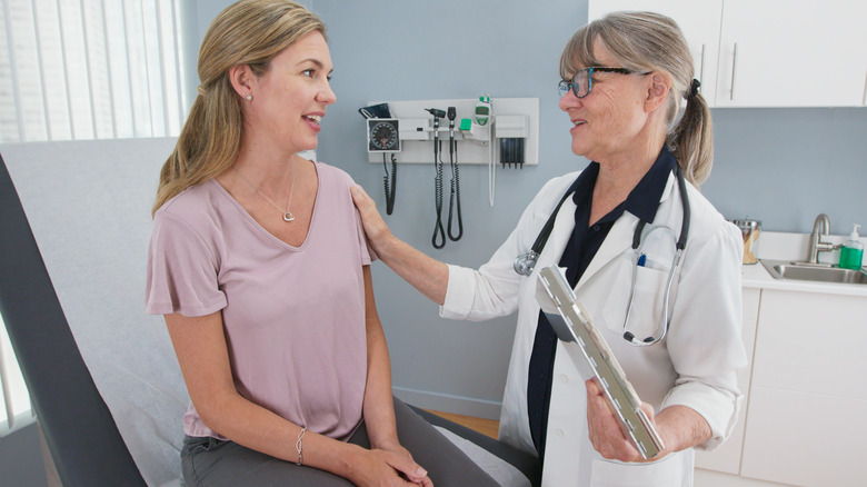 A woman speaks with her OB-GYN