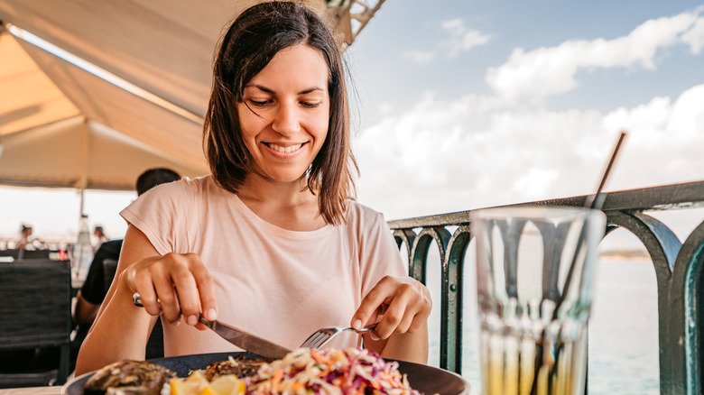 Woman eating on vacation