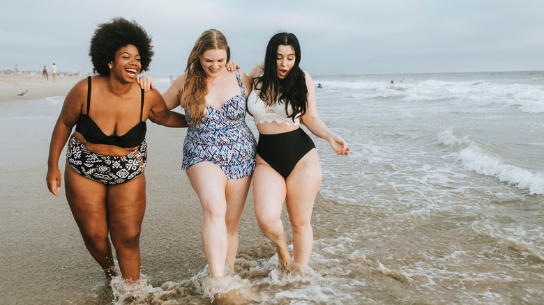 Women are happy at the beach