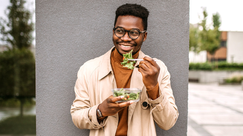 Man eating salad