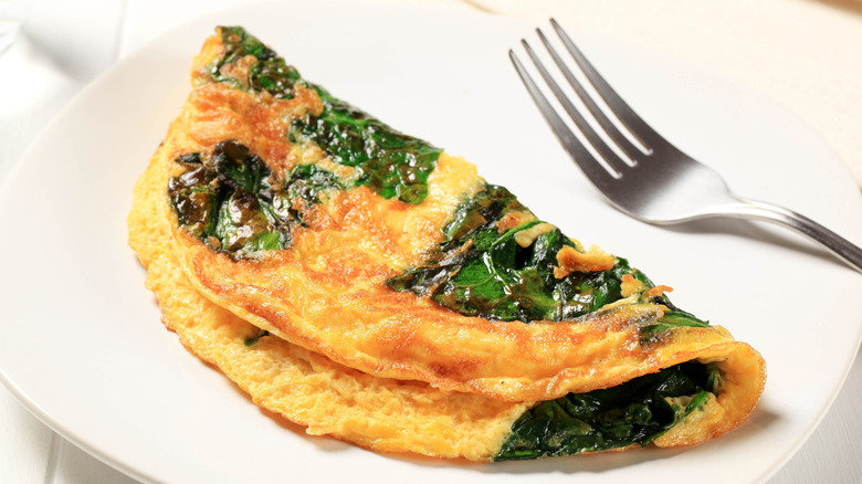 A spinach omelet on a plate