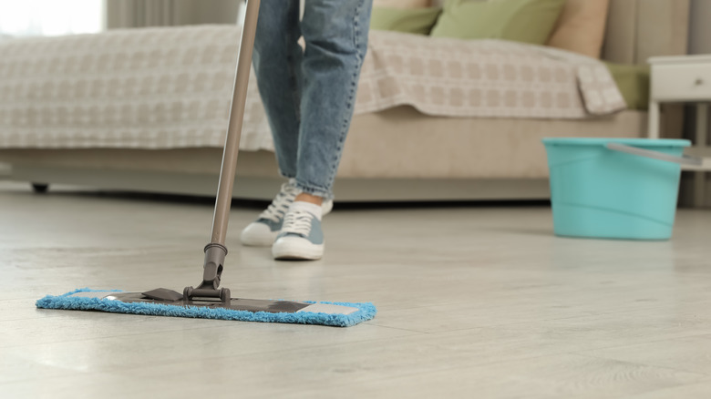 mopping a bedroom floor