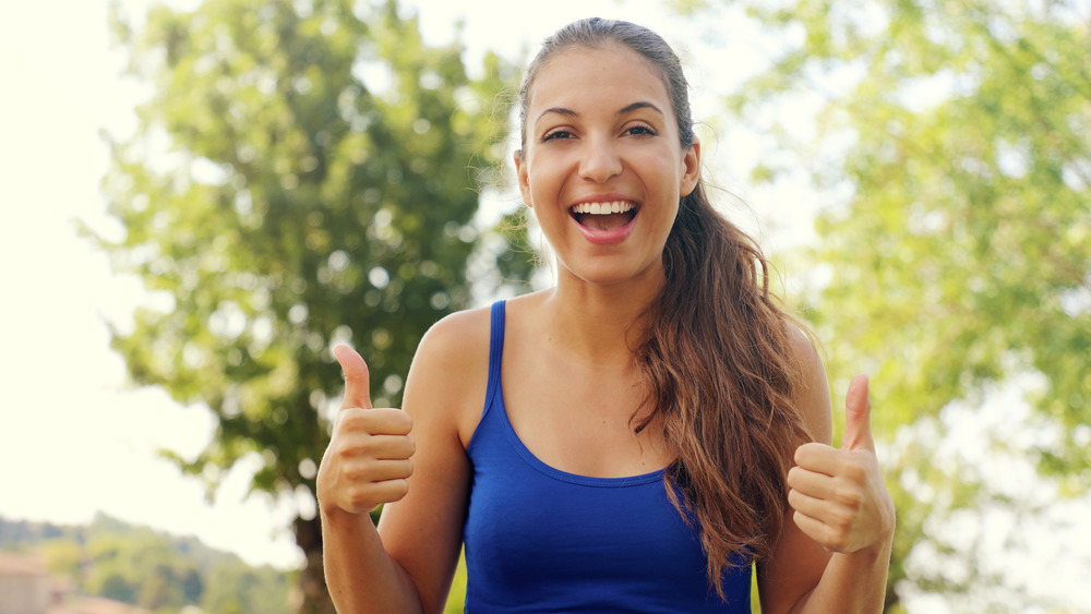 woman with thumbs up