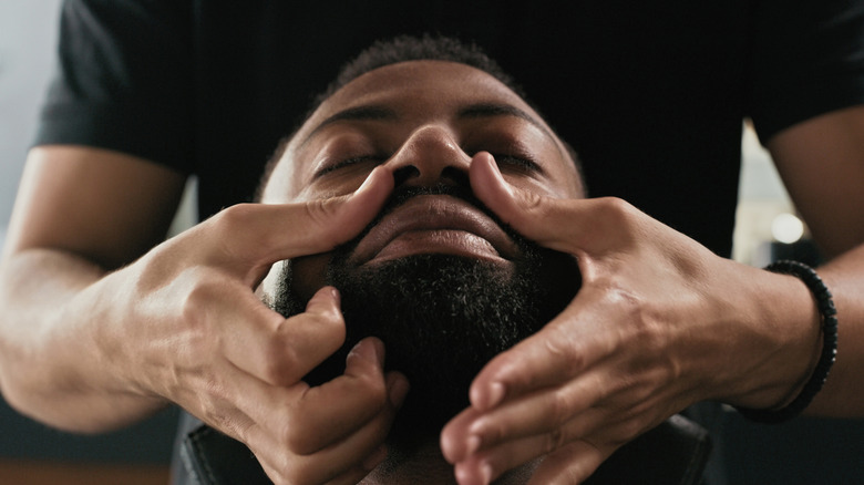 Man getting a beard massage