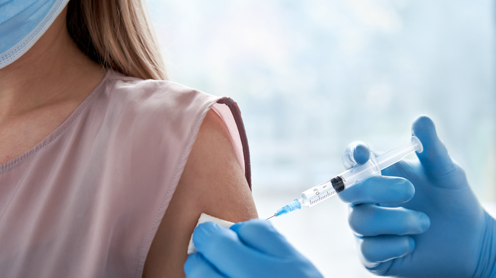 close up of a woman getting a COVID-19 vaccine 
