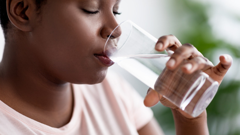 Woman drinking glass of water