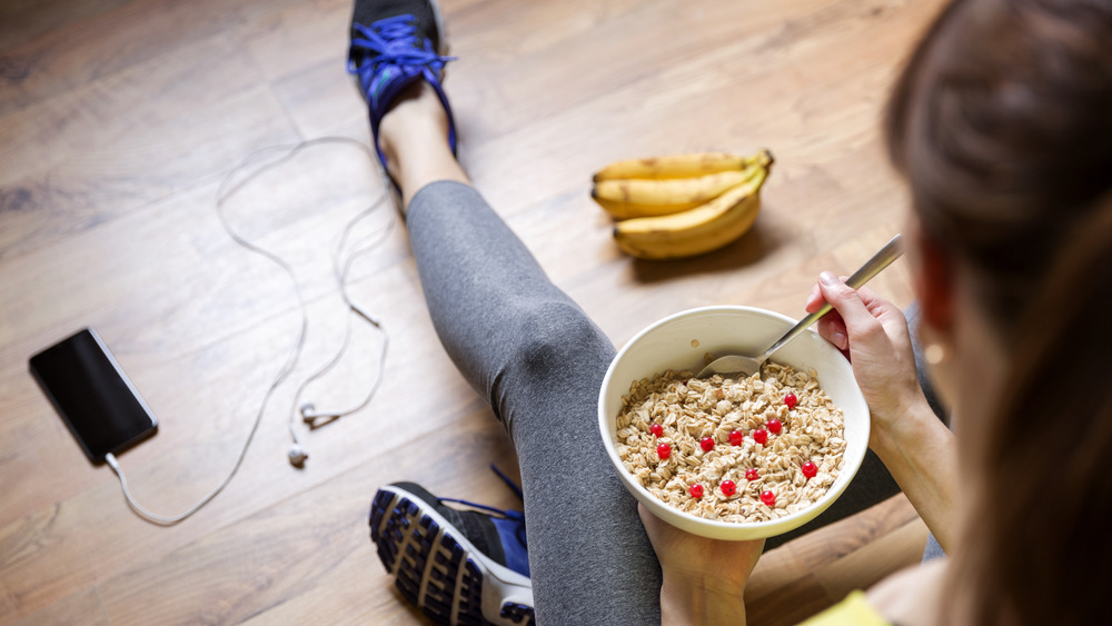 girl eating oatmeal before a workout