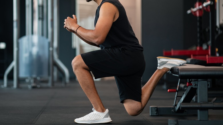 man doing bulgarian split squats