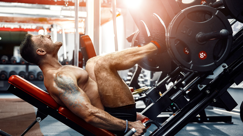 man doing leg press