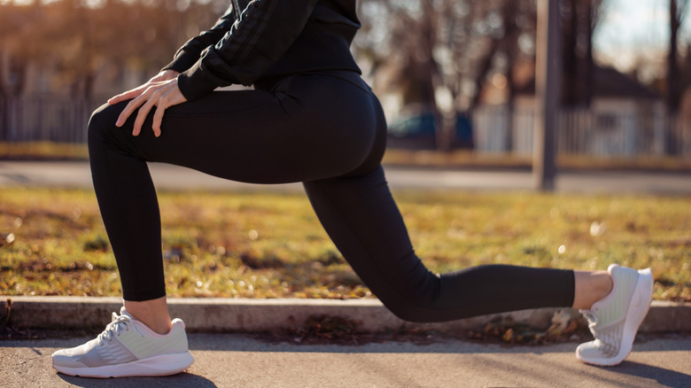 person doing walking lunge