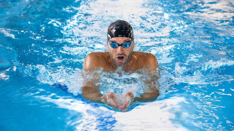 Man swimming in pool